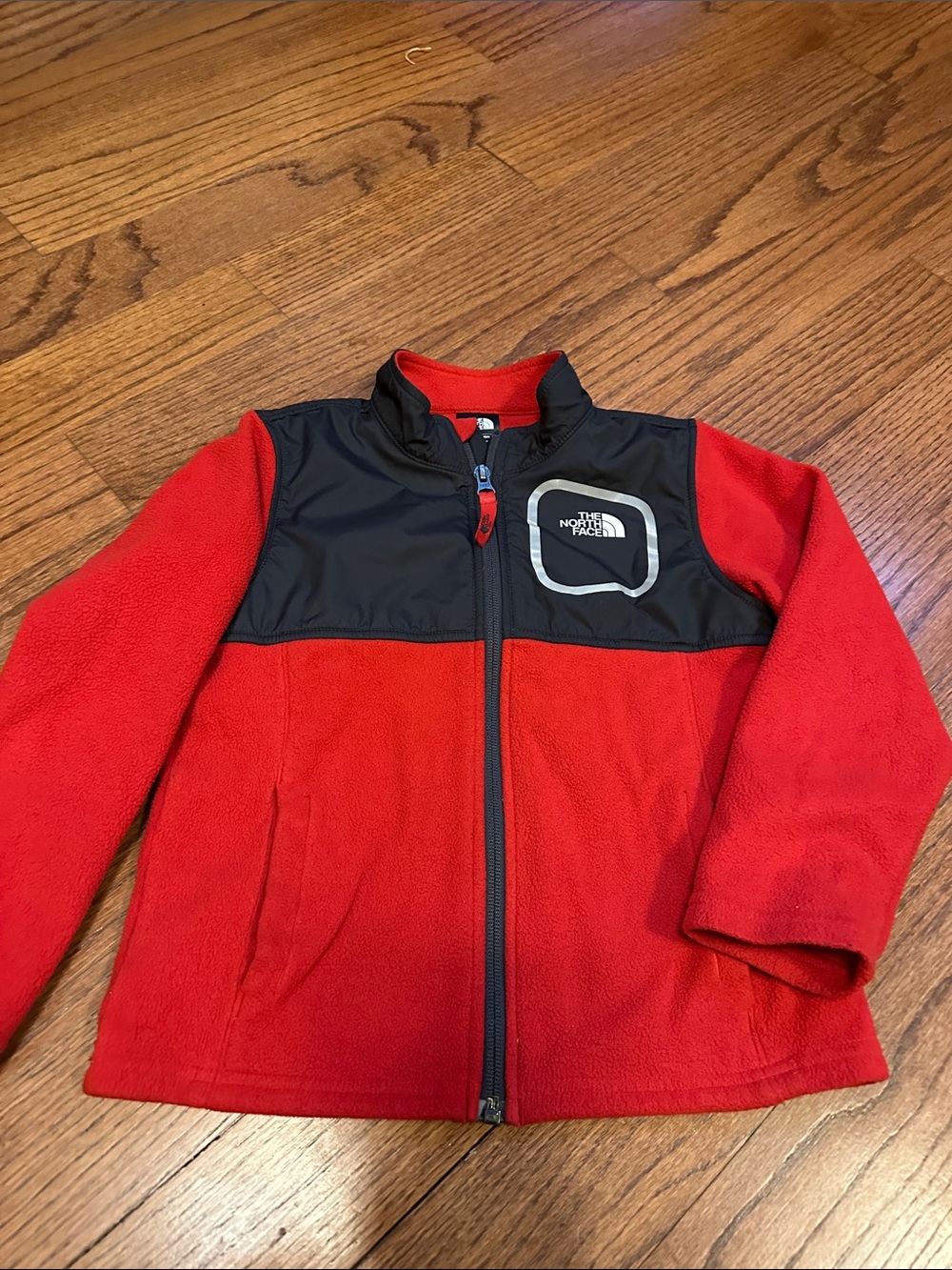 The North Face Red Fleece Jacket with Black Shoulder Yoke